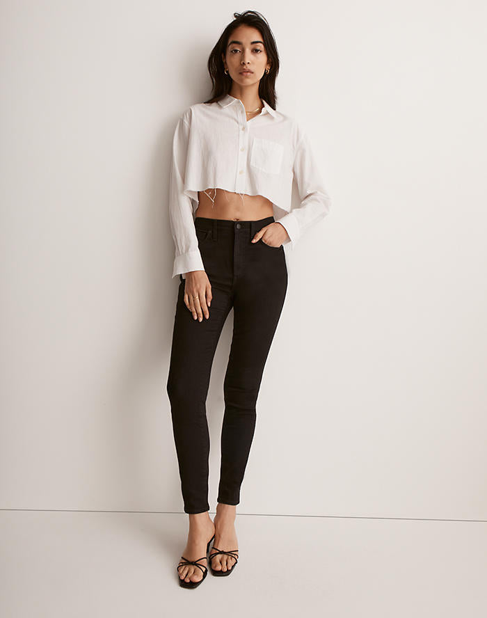 woman wearing black diesel high rise skinny jeans